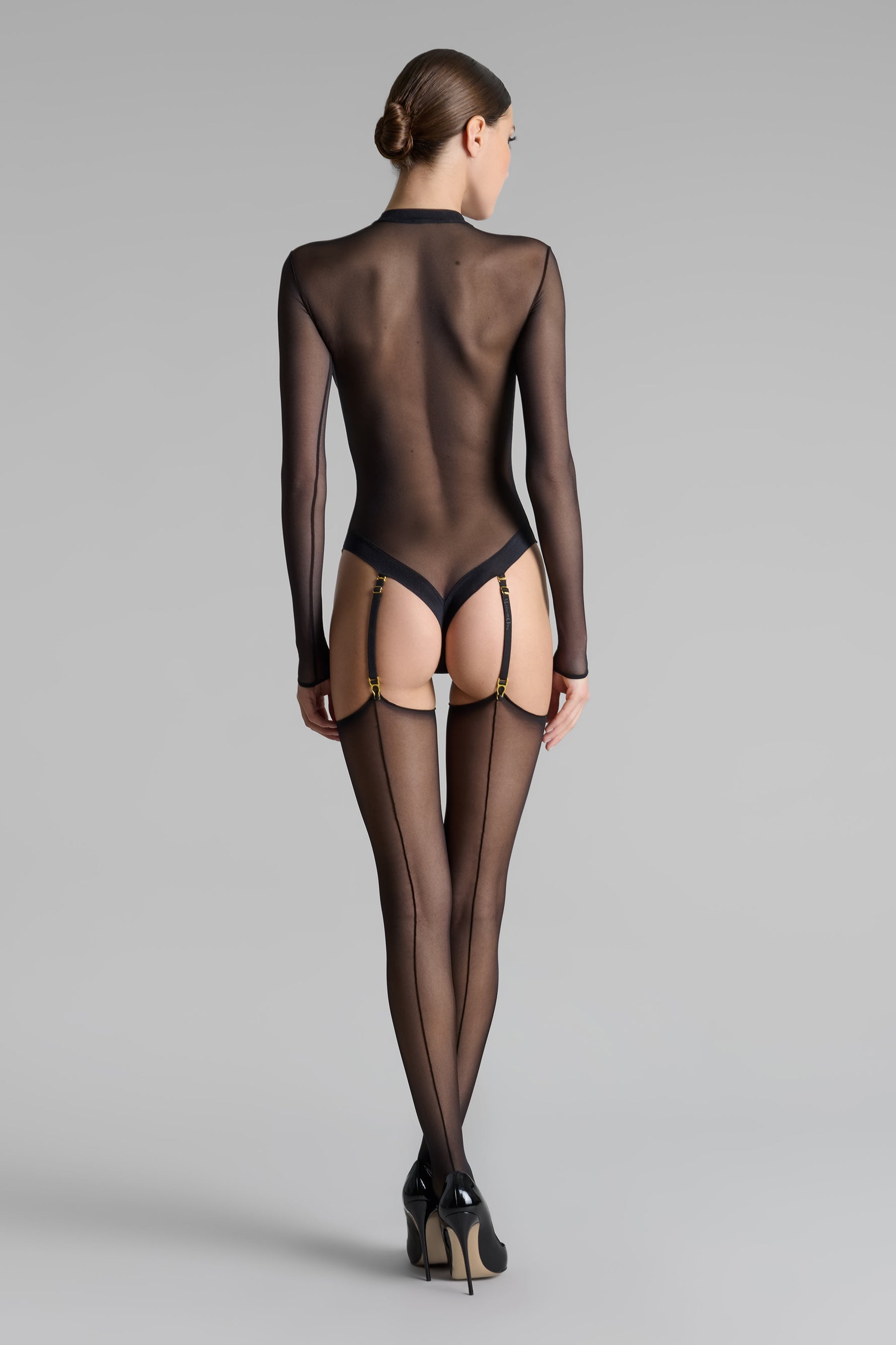 moteriškos juodos prisegamos kojinės su siūlėmis