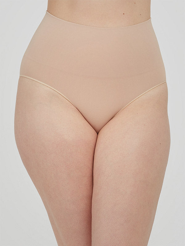 Spanx koreguojančios paaukštinto juosmens kelnaitės iš perdirbto nailono "Ecocare Nude"