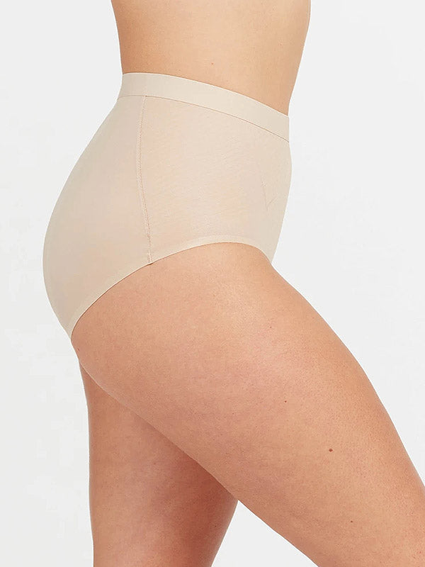 Spanx koreguojančios aukšto juosmens kelnaitės "Thinstincts® Nude"
