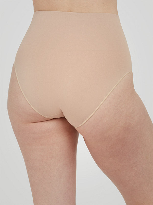 Spanx koreguojančios paaukštinto juosmens kelnaitės iš perdirbto nailono "Ecocare Nude"
